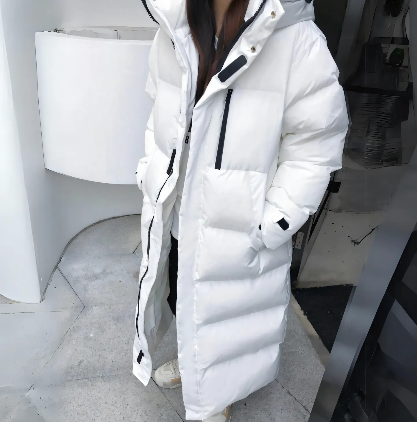 Winddichte lange Daunenjacke